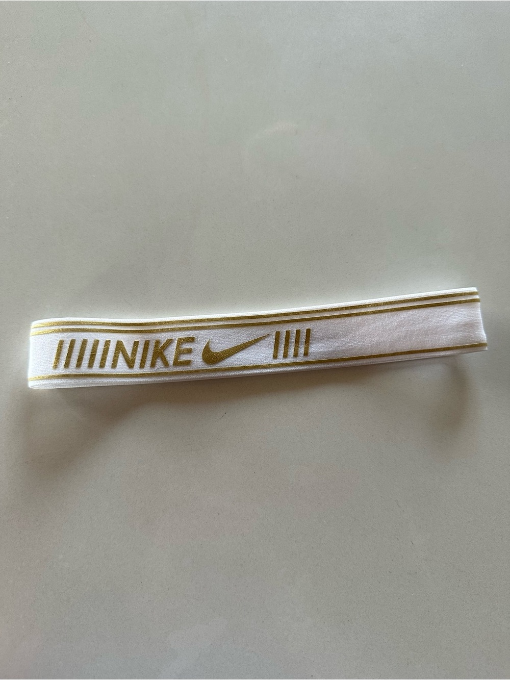 Nike White Headband with Gold Logo
